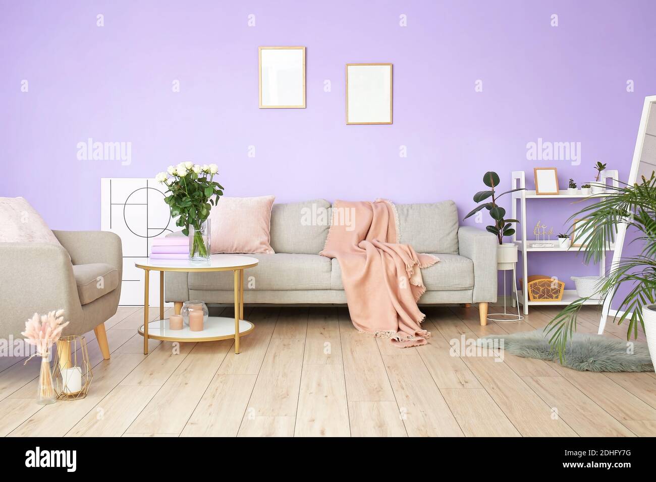 Stylish interior of living room with sofa Stock Photo - Alamy