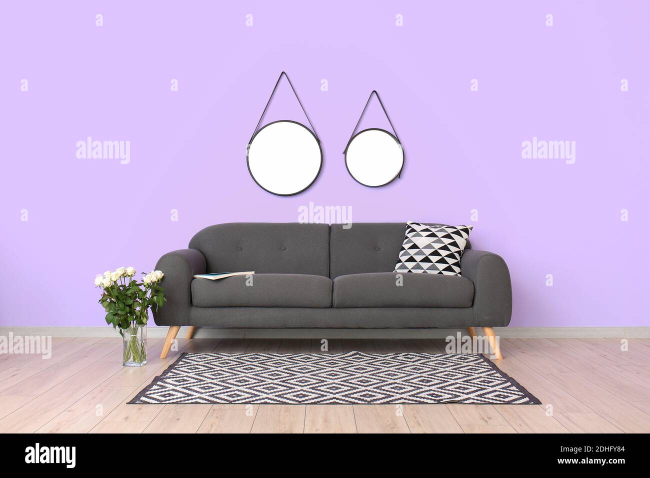 Stylish interior of living room with sofa Stock Photo - Alamy