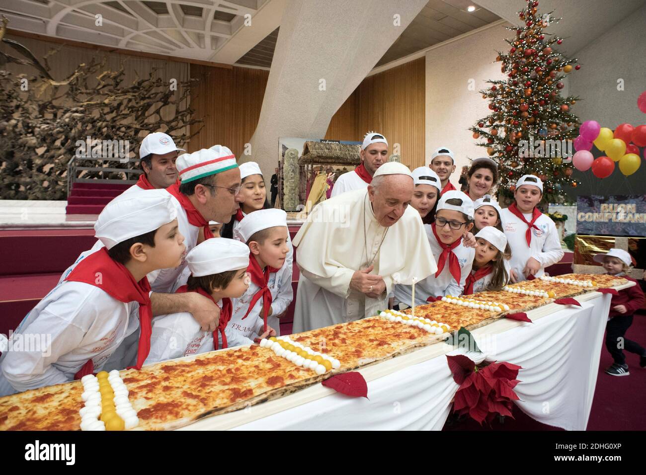 Pope Francis has blown out his birthday candle on an extra-long pizza at the Vatican on december 17, 2017 to the delight of children. Francis, who turned 81 then told the children, who use the Vatican pediatric clinic ‘Santa Marta’, to ‘eat all four meters’ saying it will make them grow. Photo by ABACAPRESS.COM Stock Photo