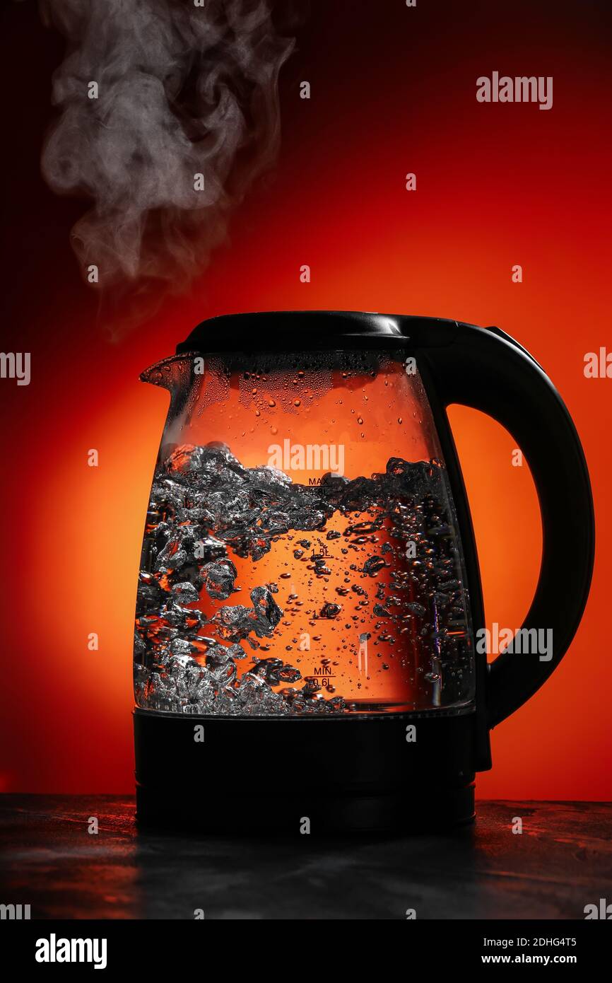 modern electric kettle boiling water using Schott Duran heatproof  borosilicate glass Stock Photo - Alamy