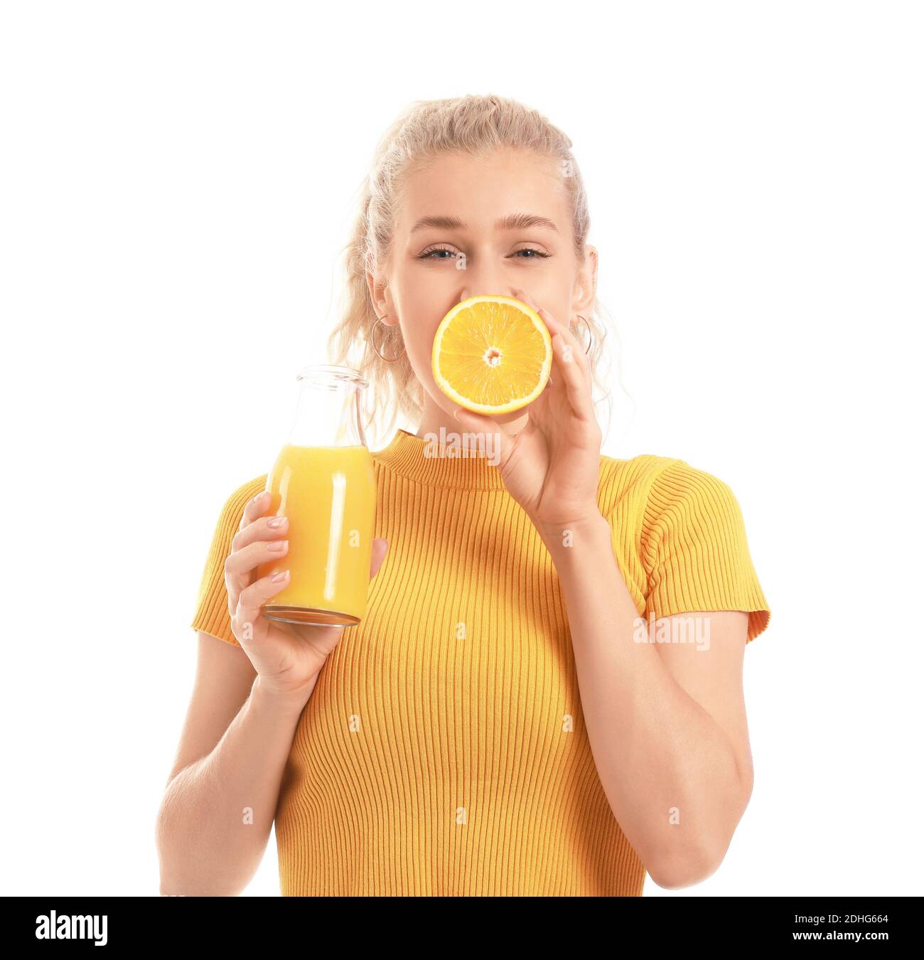 Beautiful young woman with orange juice on white background Stock Photo