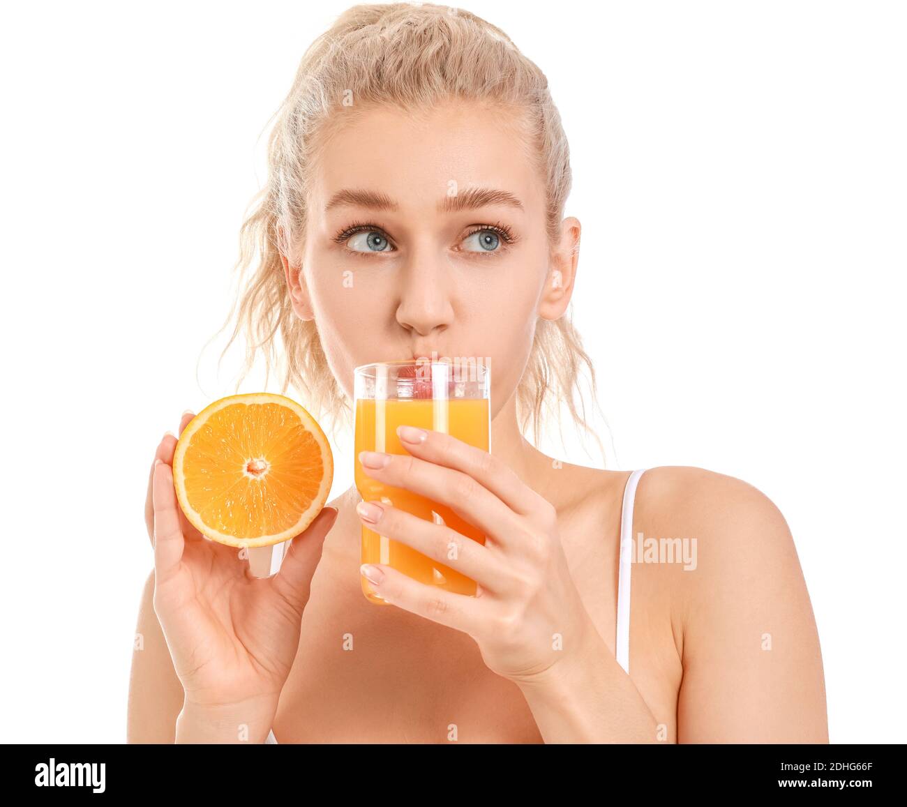 Beautiful young woman with orange juice on white background Stock Photo