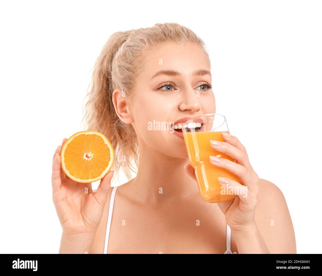 Beautiful young woman with orange juice on white background Stock Photo