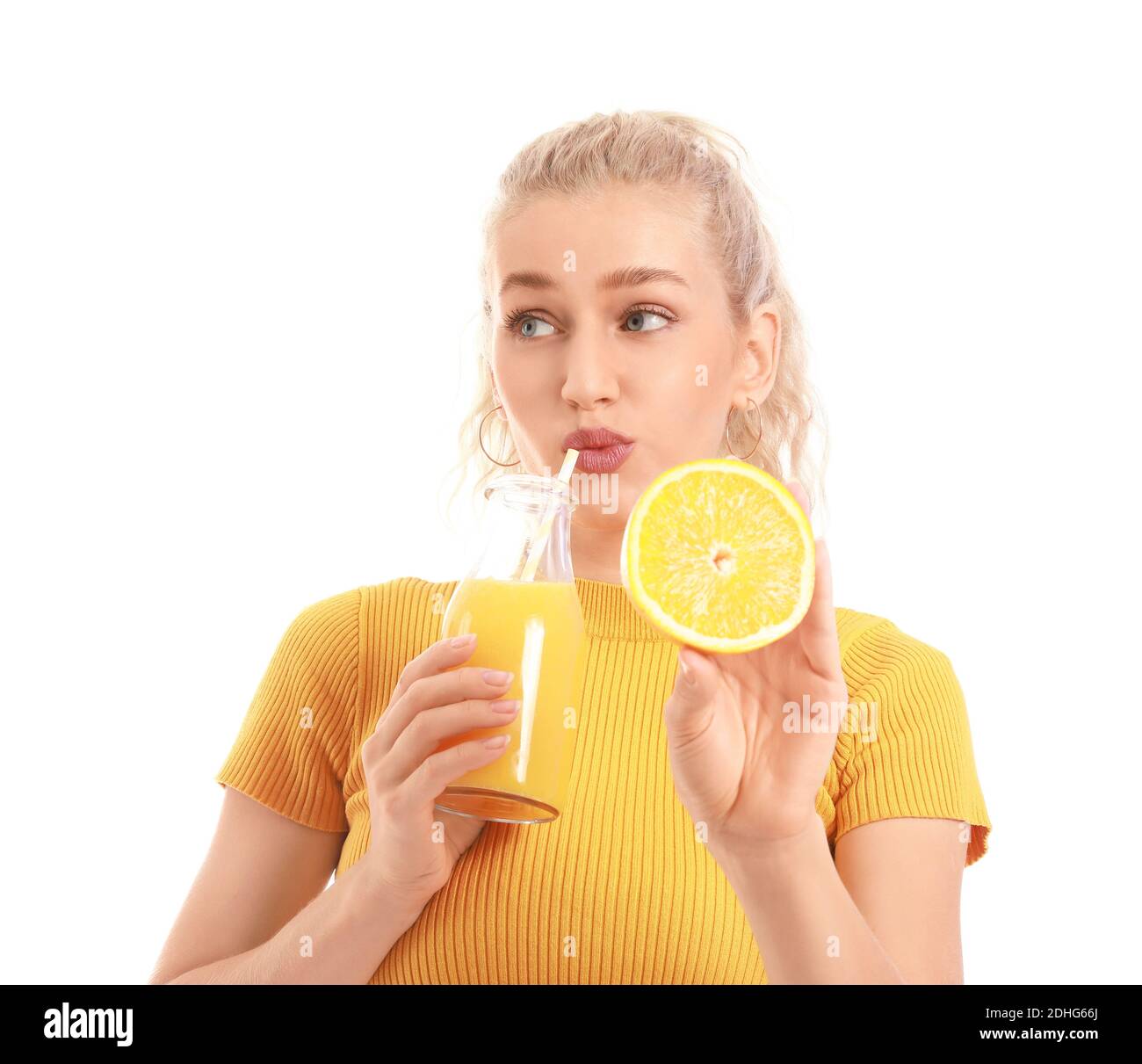 Beautiful young woman with orange juice on white background Stock Photo