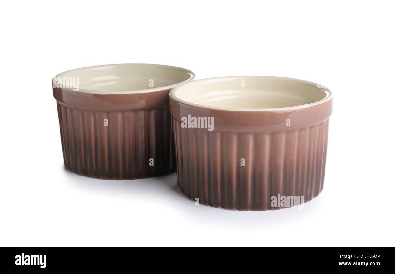 Ceramic ramekins on white background Stock Photo