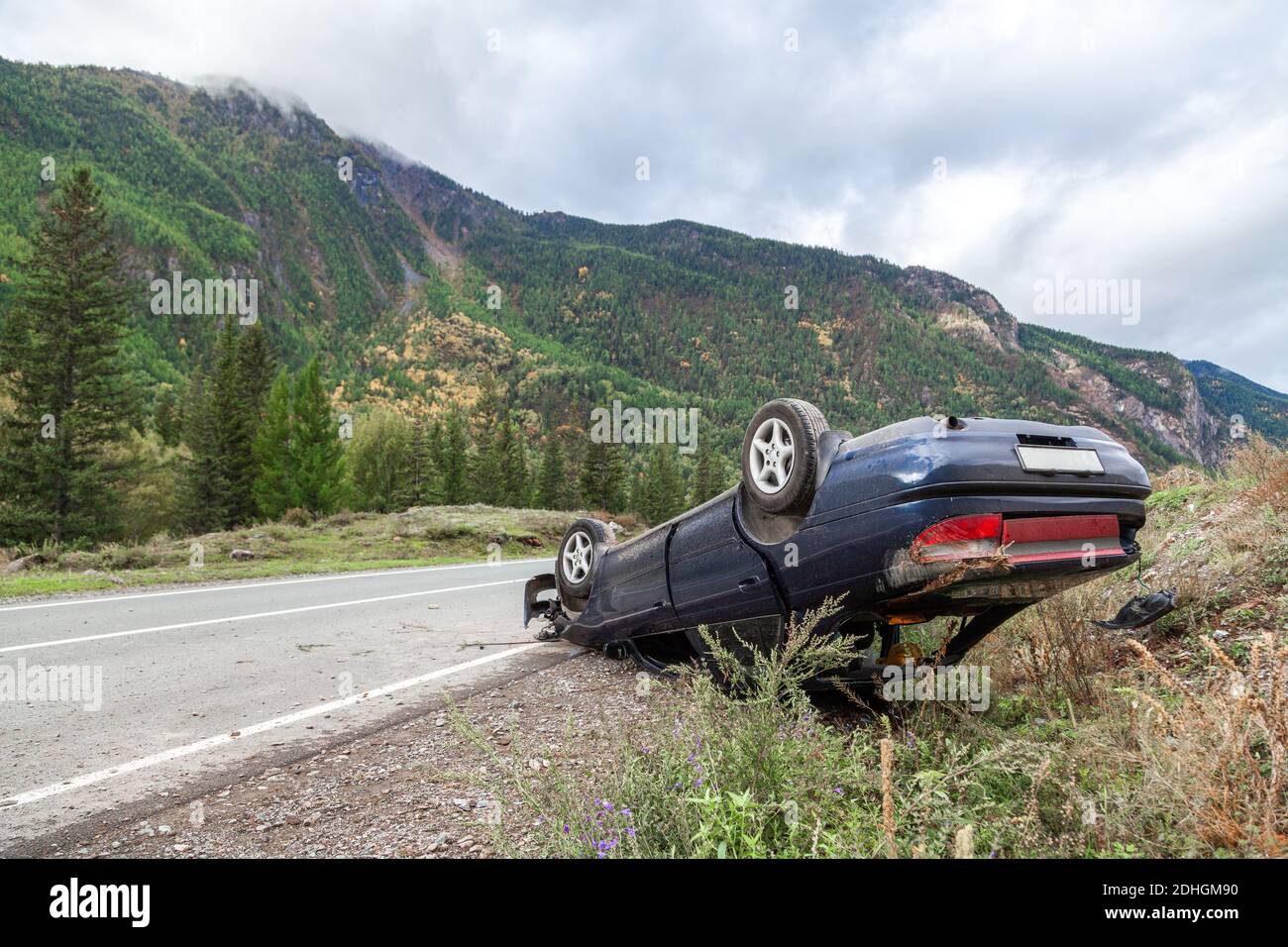 Crushed car accident place on a bend on a mountain road Stock Photo Alamy