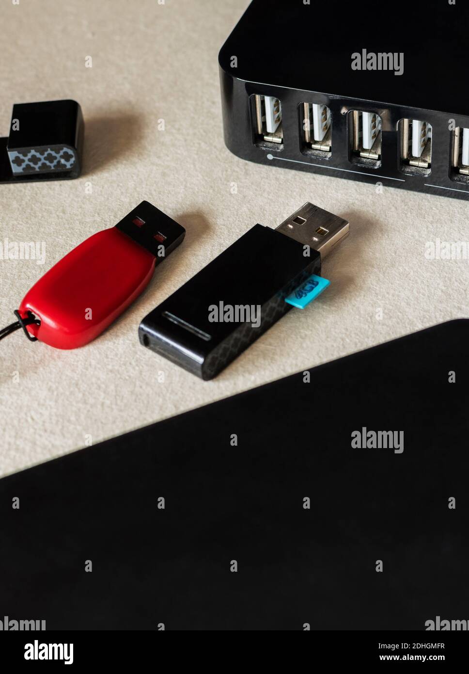 A vertical selective focus closeup of flash drives, and multiple USB