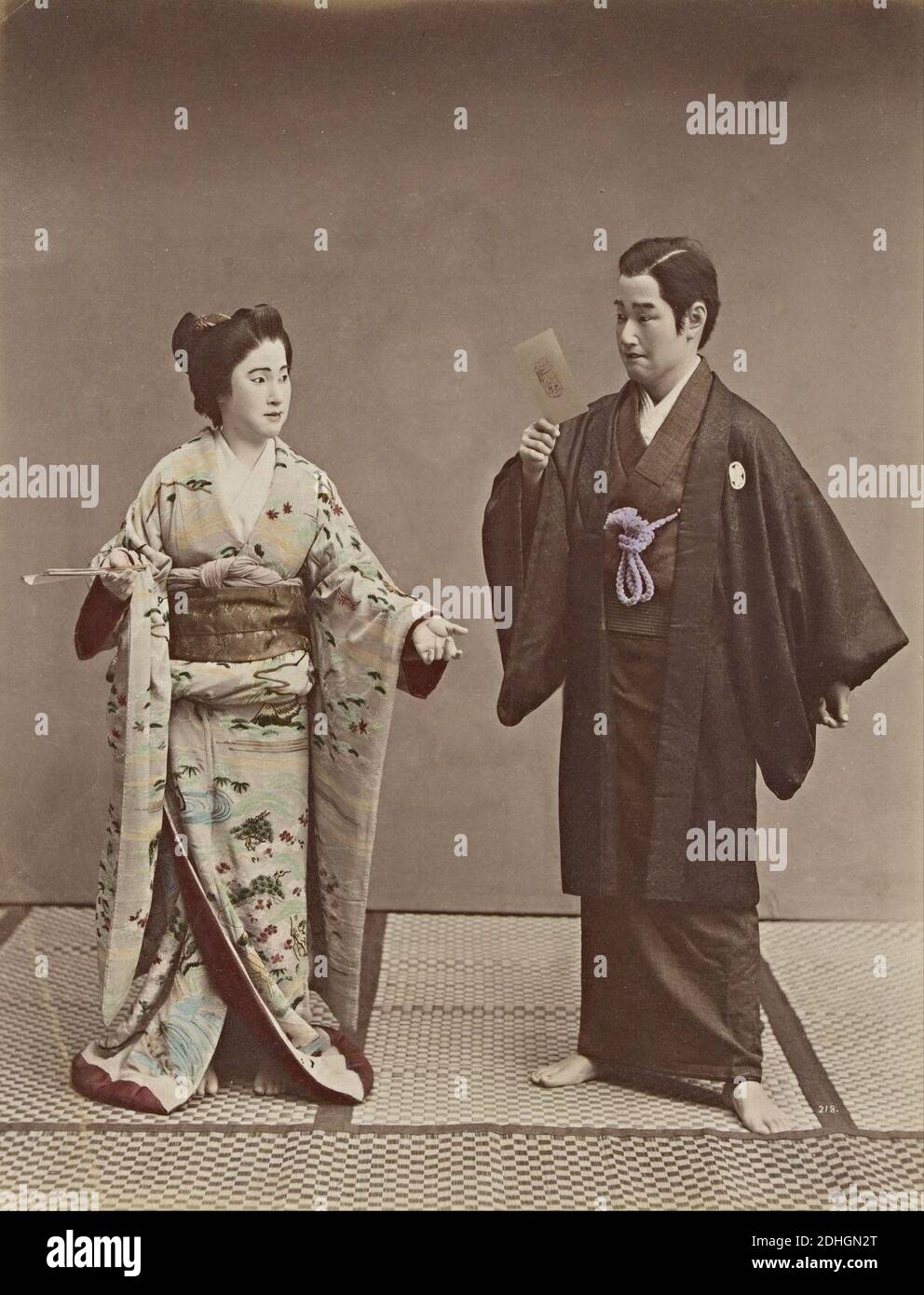 Kusakabe Kimbei - No title (Couple with a cabinet photograph and ghost in background) Stock Photo