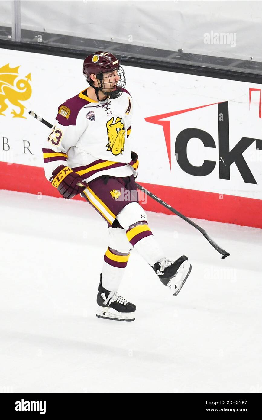 December 10, 2020 Minnesota-Duluth Bulldogs forward Nick Swaney (23)  celebrates after scoring a shootout goal to give Minnesota Duluth an extra  conference point after a NCAA D1 men's hockey game between the