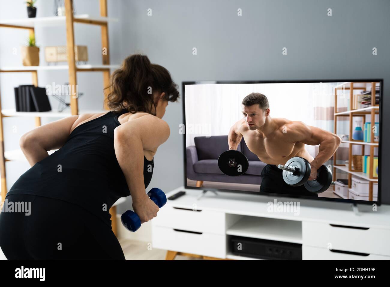 Online TV Home Fitness Workout And Exercise Stock Photo