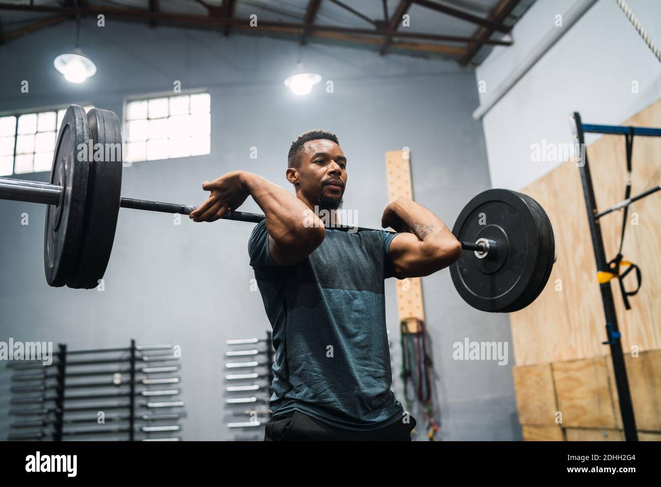 Crossfit athlete doing exercise with a barbell Stock Photo - Alamy