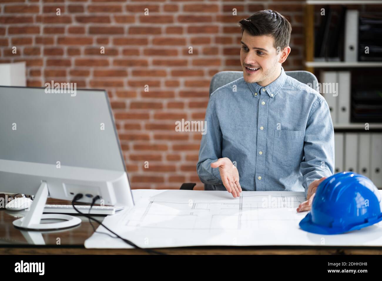 Architect In Online Video Conference Call On Desktop Computer Stock ...