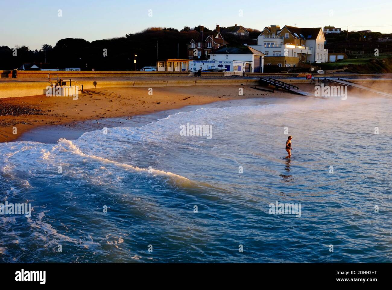 Wild swimming at daybreak sunrise dawn Freshwater Bay Isle of Wight Stock Photo