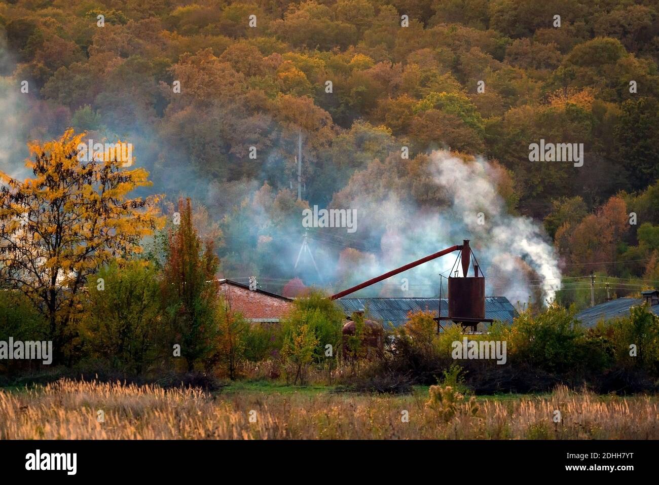 October Rural Background Rural background with countryside nature and houses in autumn evening ...