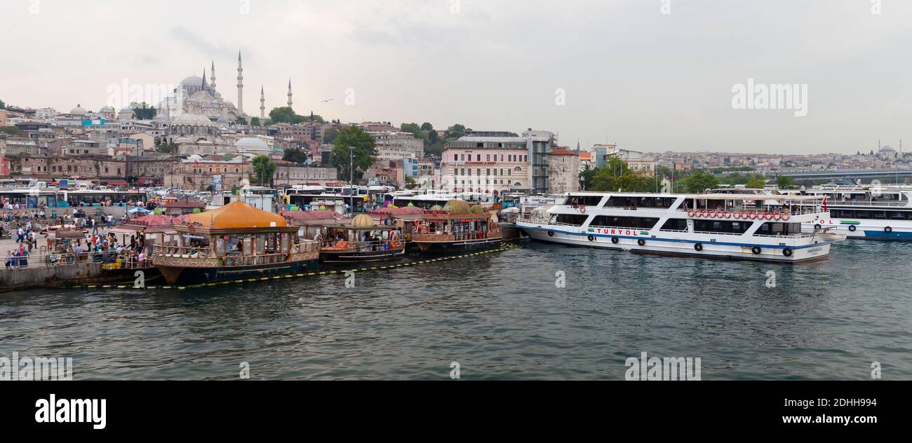 Istanbul, Turkey - June 28, 2016: Istanbul Cityscape, Eminonu former district. People are on the coast of Golden Horn Stock Photo