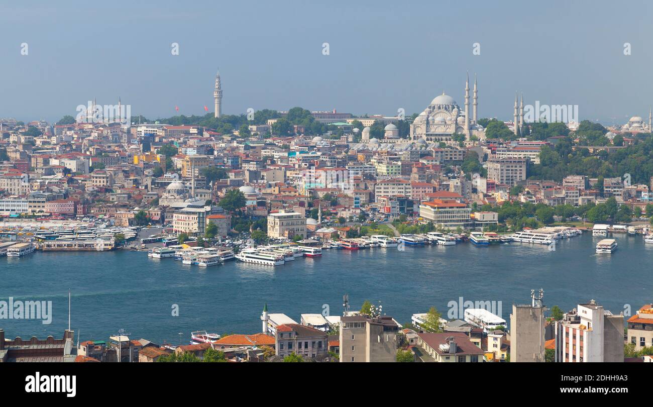Istanbul, Turkey - July 1, 2016: Istanbul skyline, Eminonu district view. Passenger boats are at Golden Horn, Suleymaniye Mosque is on a background Stock Photo