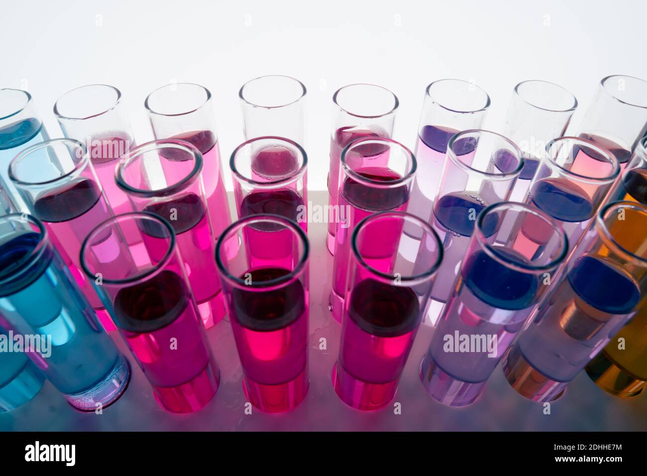 Liquid drop falling into test tubes Stock Photo