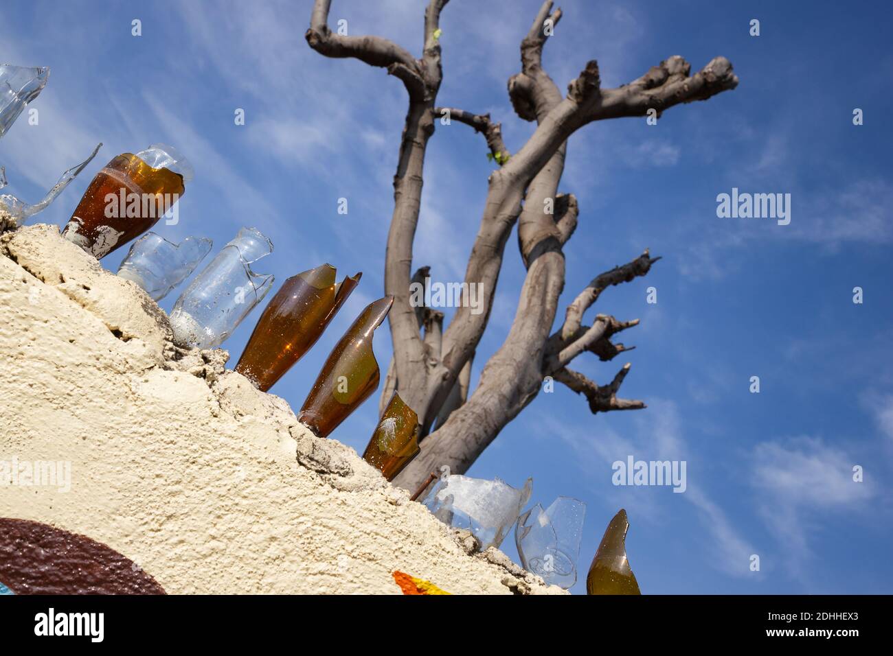 Fence with broken glass bottles to protect the property Stock Photo Alamy