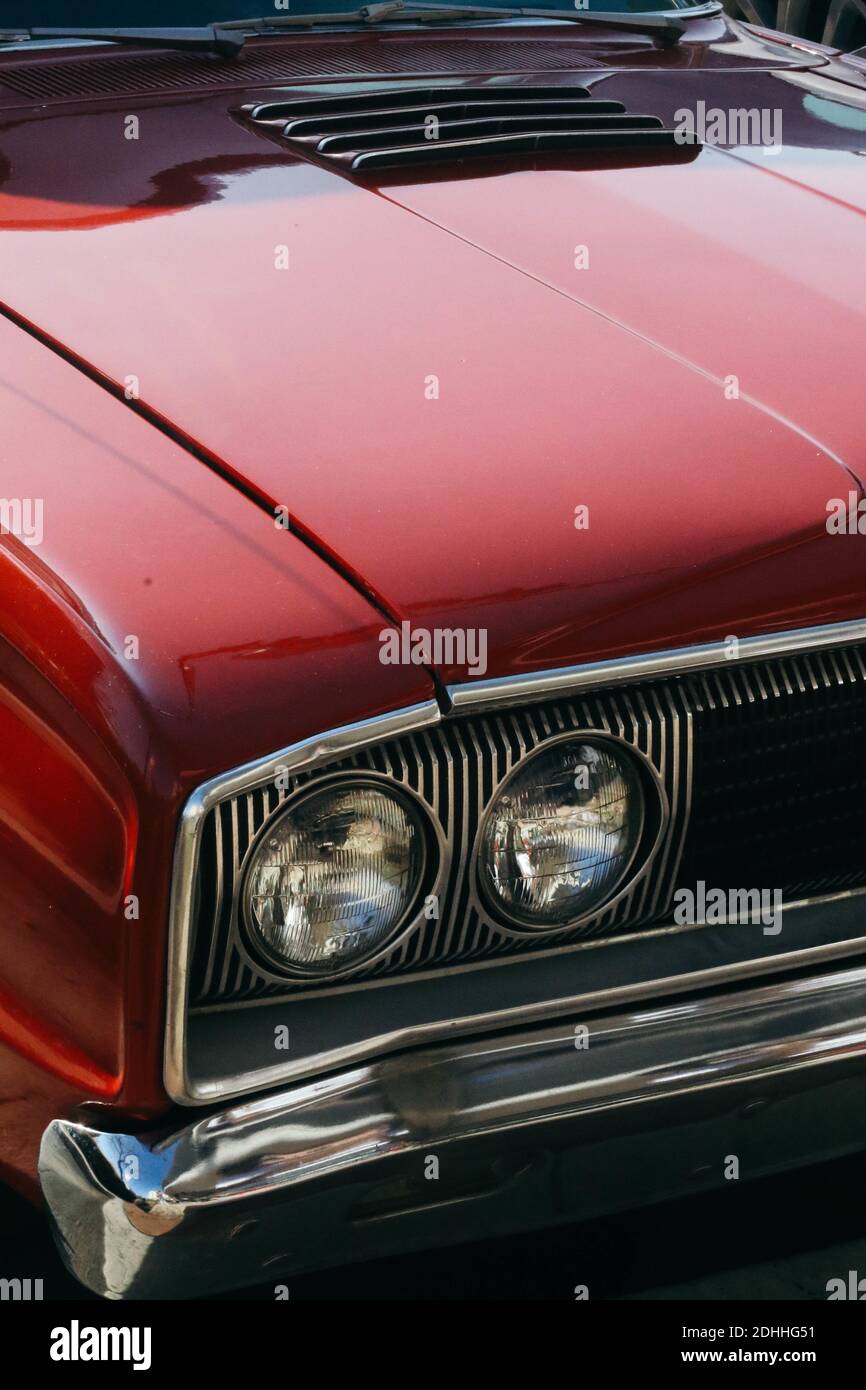 A vertical shot of headlights on a red vintage car Stock Photo - Alamy