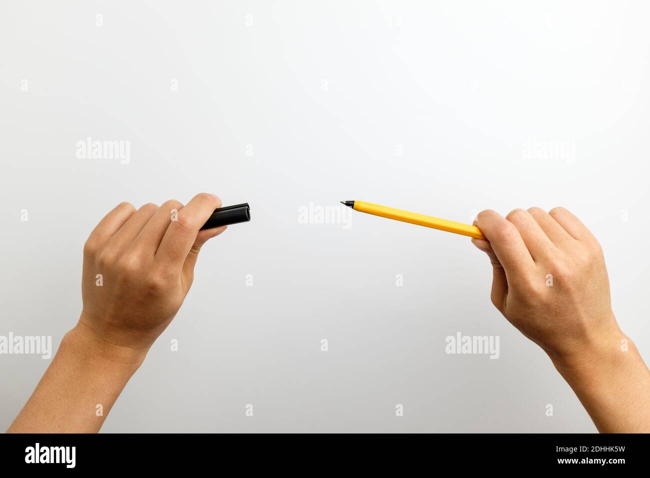 Hand with pen on white background Stock Photo - Alamy