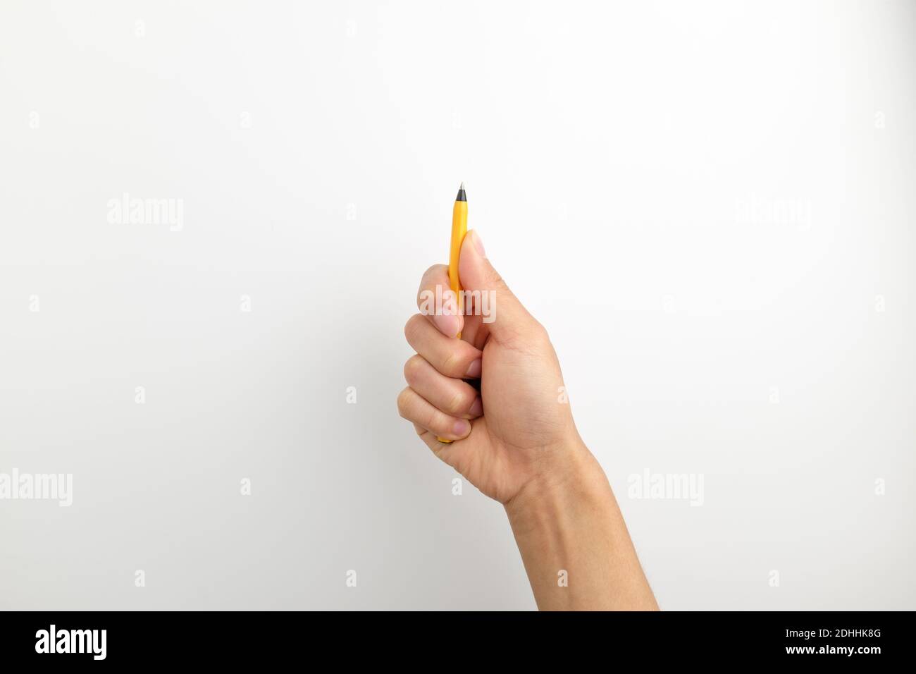 Hand with pen on white background Stock Photo - Alamy