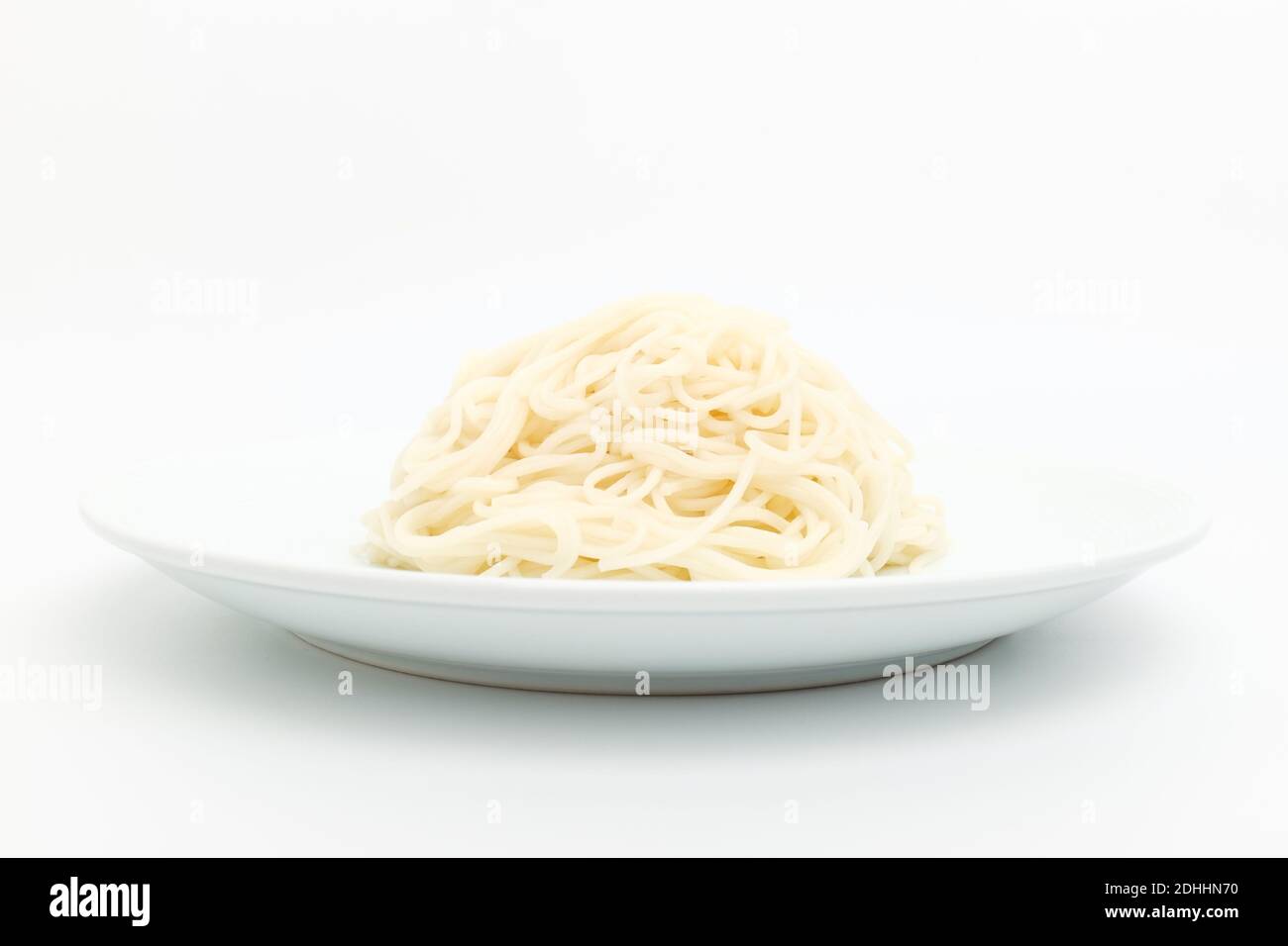 Noodles made of flour on a white background Stock Photo Alamy