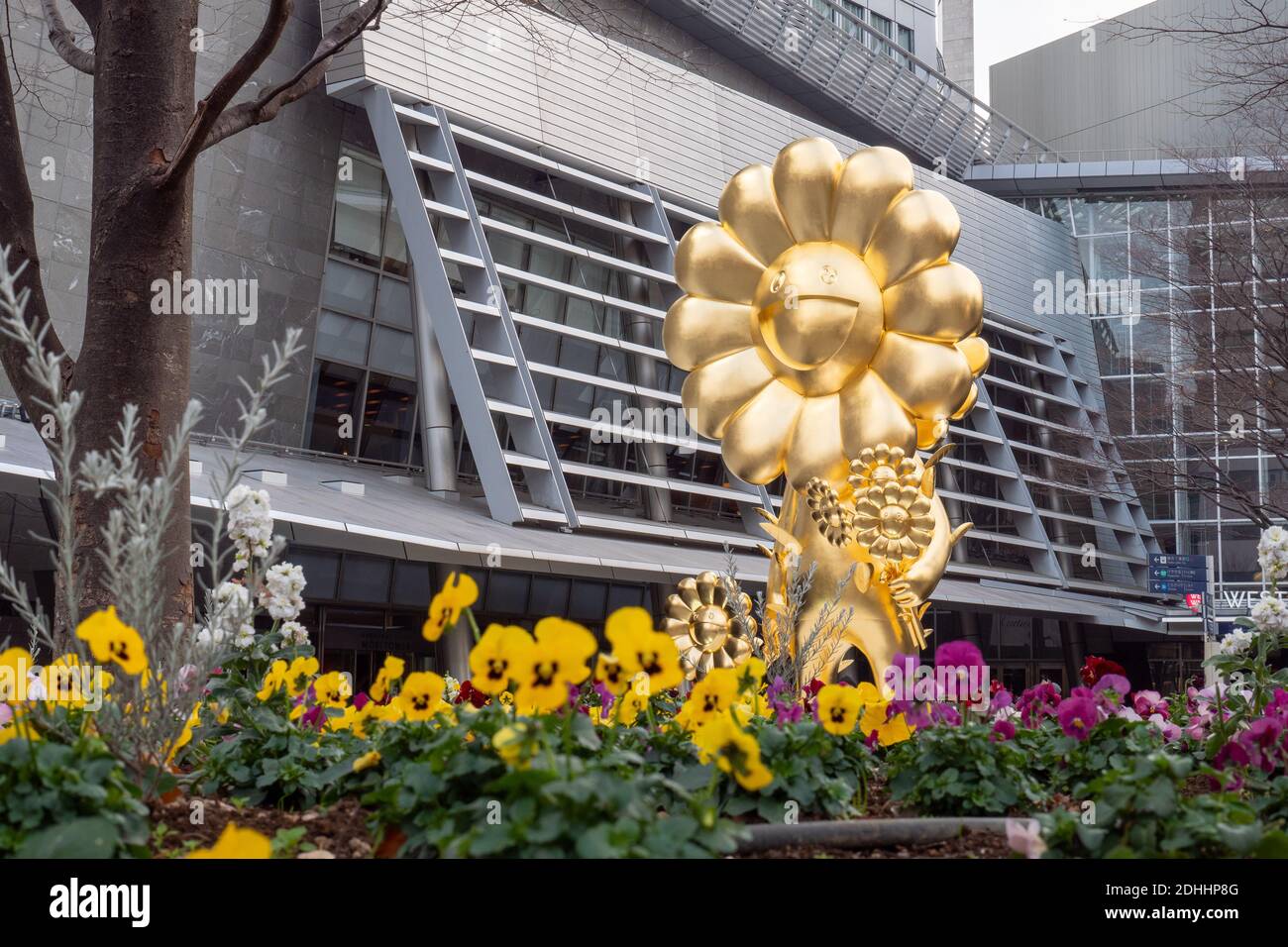 A giant gold flower statue by Japanese artist Takashi Murakami in Roppongi Hills, Tokyo, Japan
