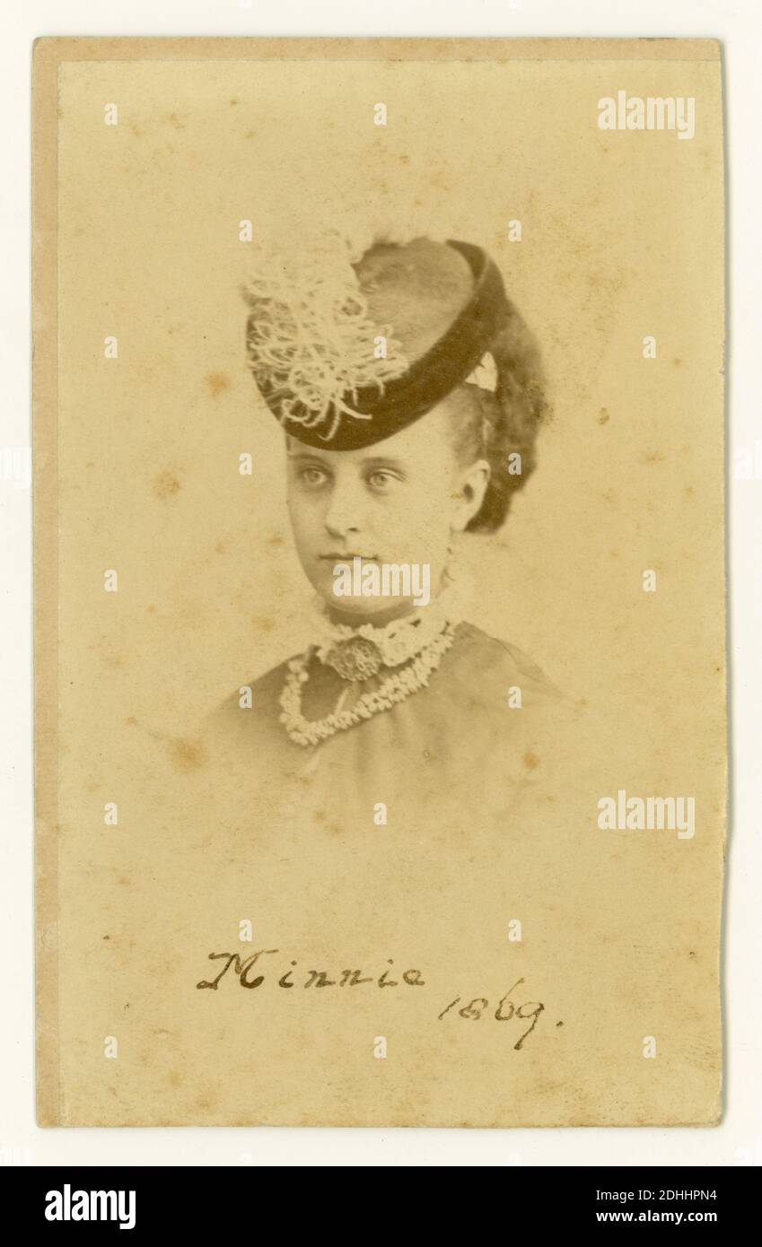 Victorian CDV (Carte de Visite) of young woman wearing a fashionable hat, called Minnie, dated 1869, by G.L. Collis, Cornhill, E.C. London, U.K. Stock Photo