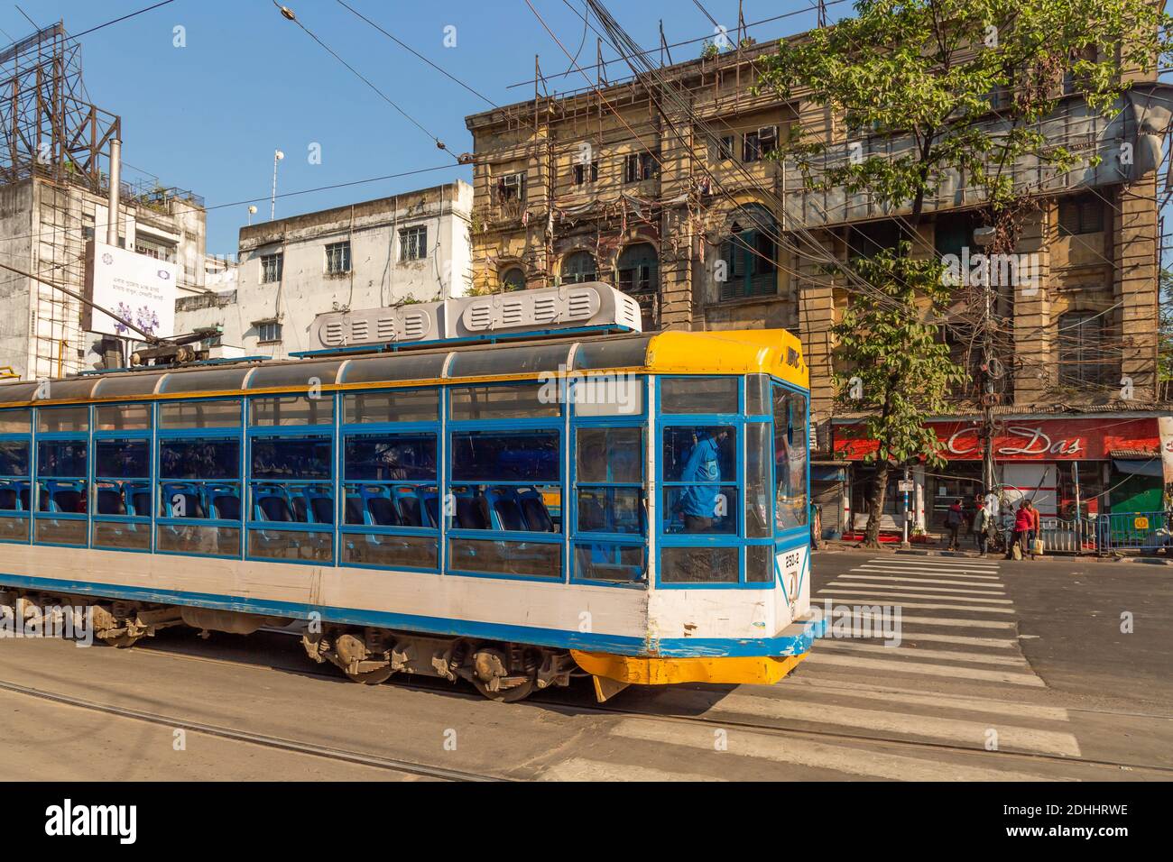 Kolkata tram on city road with old heritage buildings at Esplanade Dharmatala area, India Stock Photo