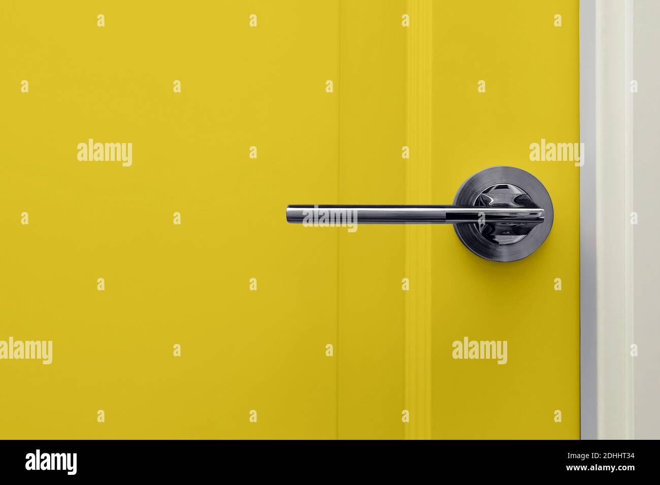 Yellow colored door in modern design apartment Stock Photo
