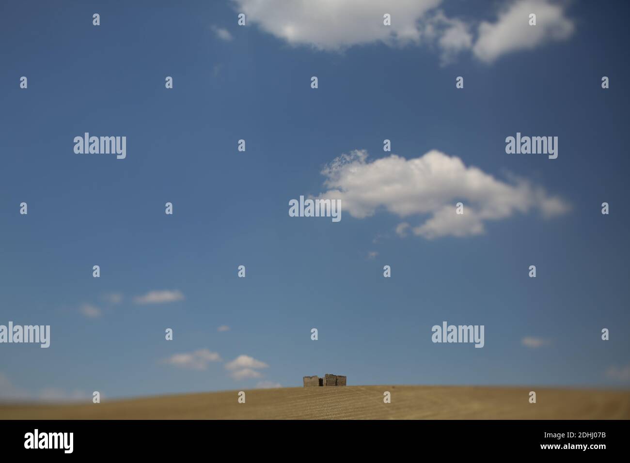 Agricultural fields under a blue cloudy sky Stock Photo - Alamy