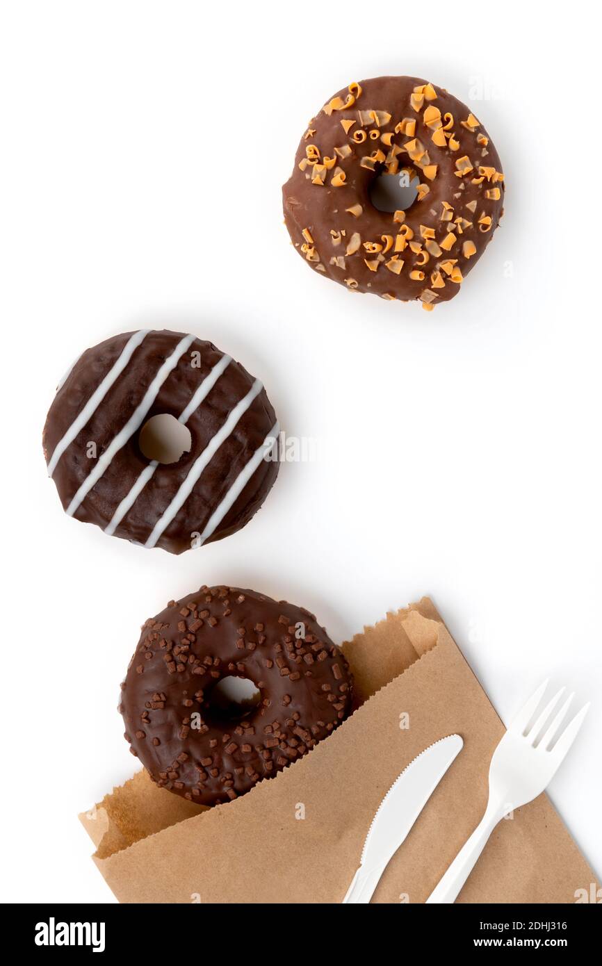 Tasty chocolate donuts on white background. Plastic-free packaging. Online  delivery take away food Stock Photo - Alamy