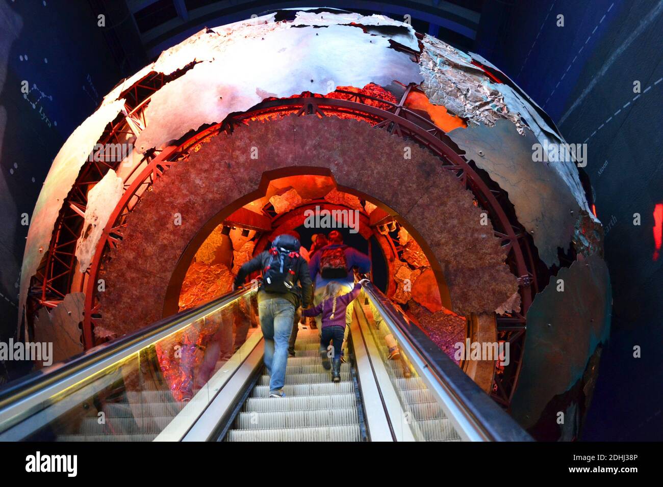 People heading into the earth's core in the Earth Hall on the escalator