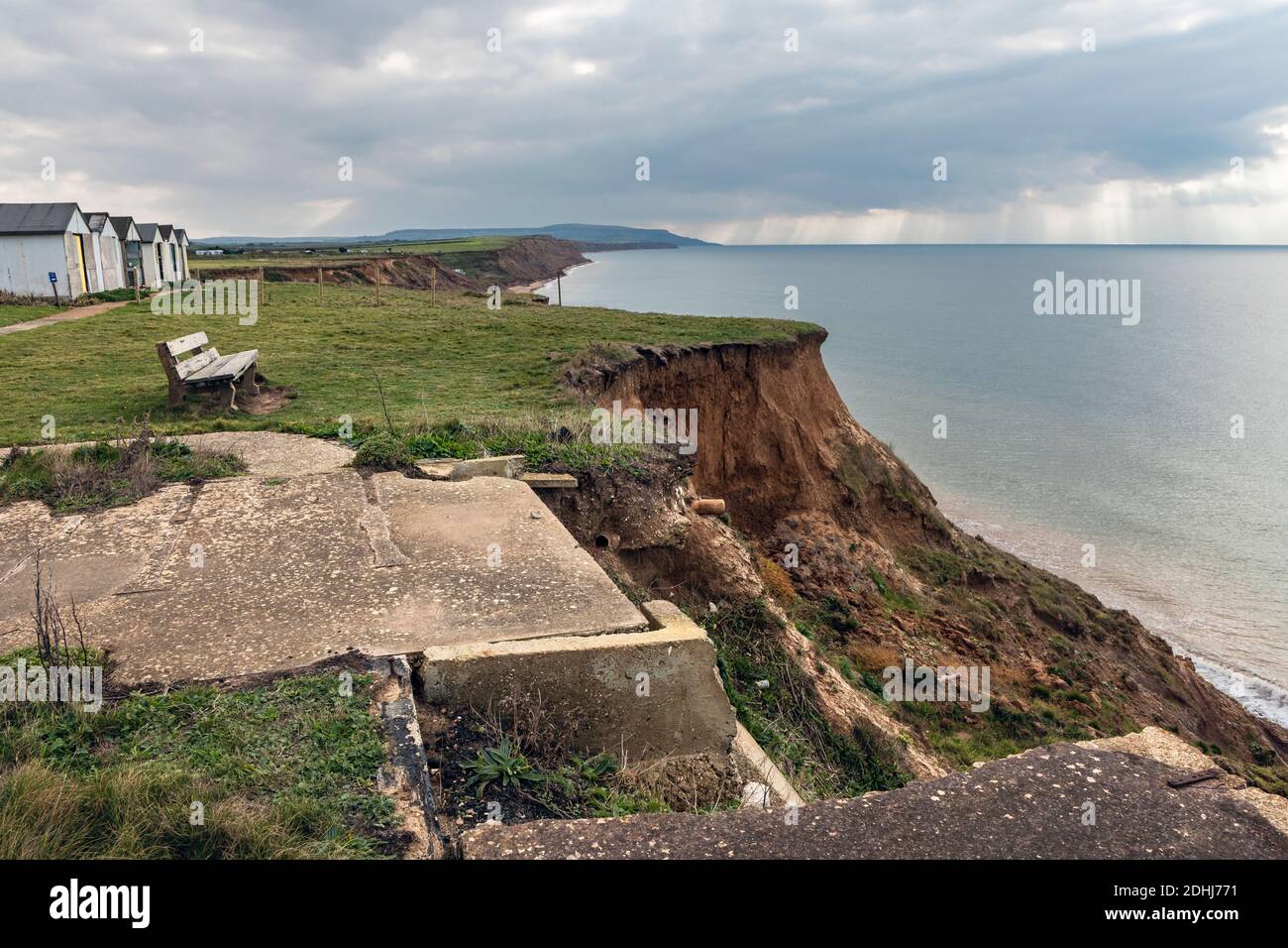 Cliff erosion and abandoned holiday chalets at Brighstone Bay, Isle of Wiight Stock Photo