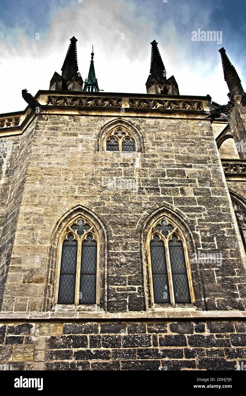 Gothic cathedral detail with three pointed arched windows Stock Photo