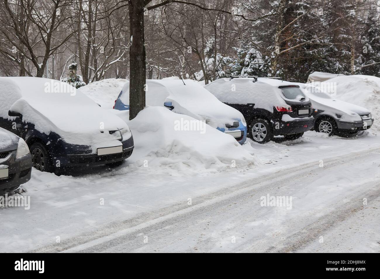 cars in the Parking lot in the winter under the snow Stock Photo - Alamy