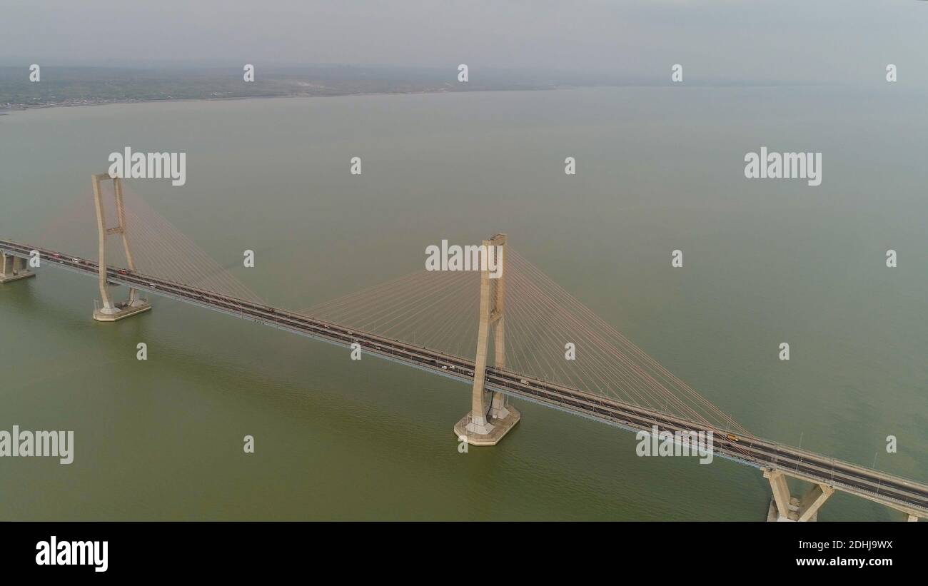Picture of aerial view suspension cable bridge Suramadu over madura strait ...