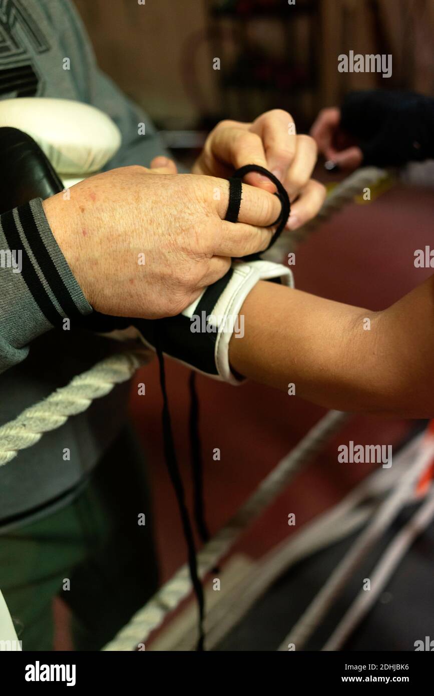 Man Coach Help Woman To Tying Boxing Glove On a Hand Stock Photo Alamy