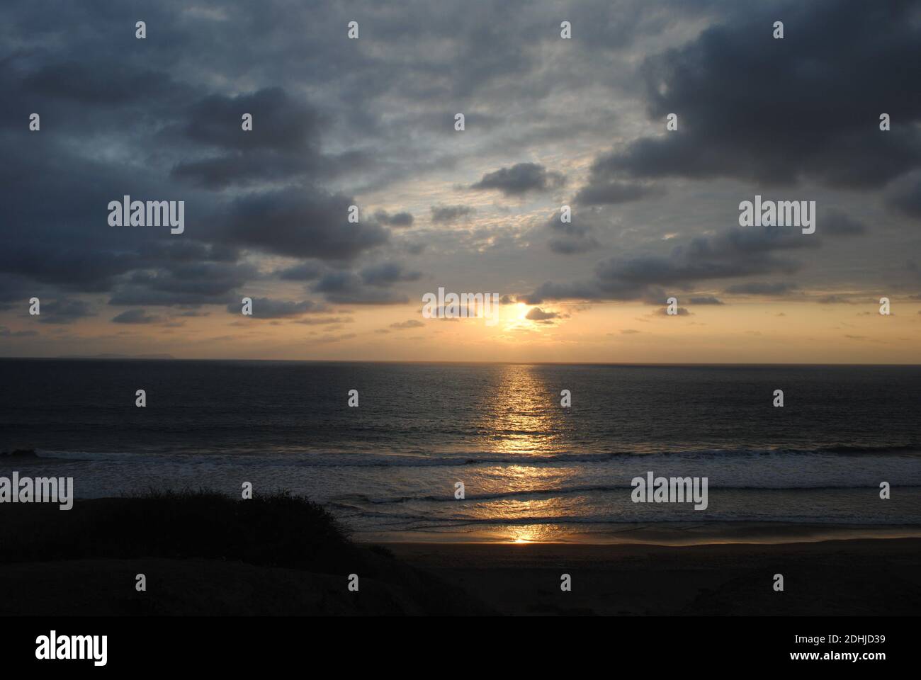 A breathtaking peaceful sunset captured at the beach Stock Photo - Alamy
