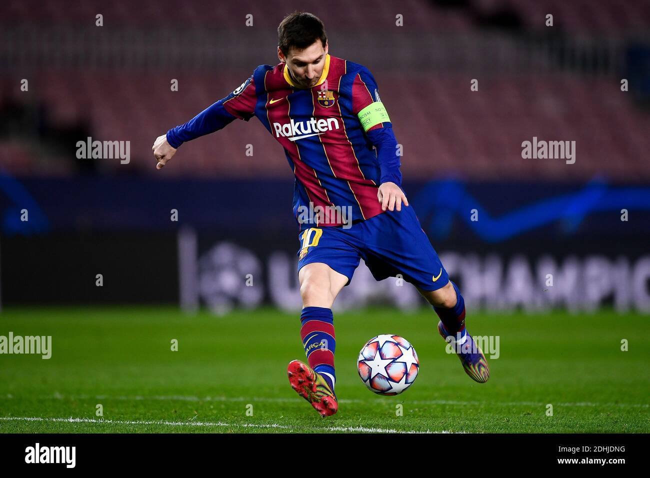 Barcelona, Spain - 08 December, 2020: Lionel Messi of FC Barcelona kicks  the ball during the UEFA Champions League Group G football match between FC  Barcelona and Juventus. Juventus FC won 3-0