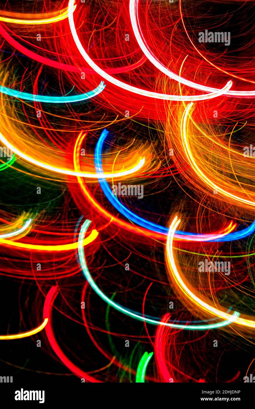 Abstract light trails on dark background Stock Photo - Alamy
