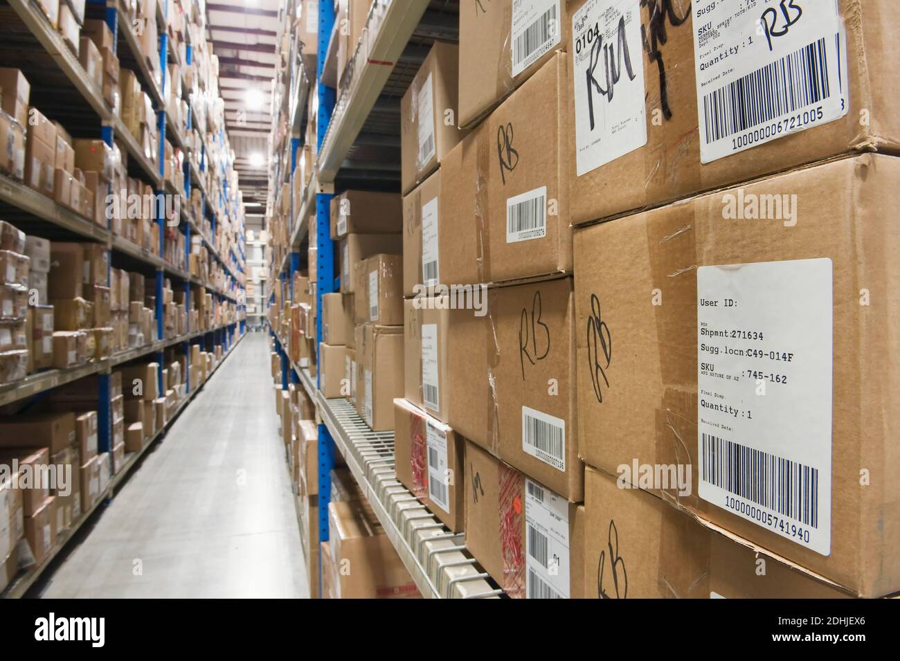 cardboard-boxes-on-tall-shelves-in-warehouse-stock-photo-alamy