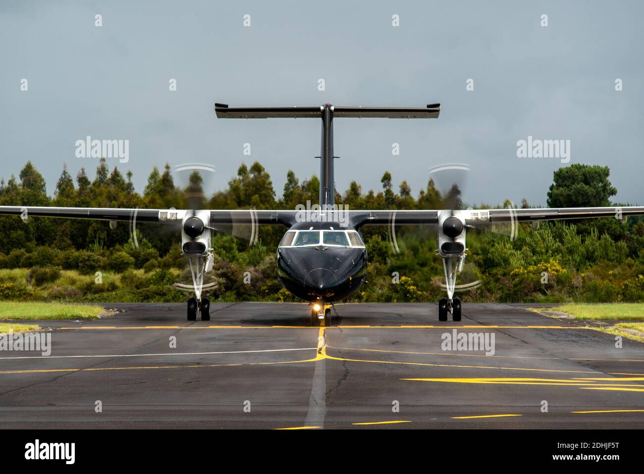 Head on shot of an Air New Zealand Bombardier Dash 8 Q300 aircraft in all black livery as it arrives at Taupo Airport Stock Photo