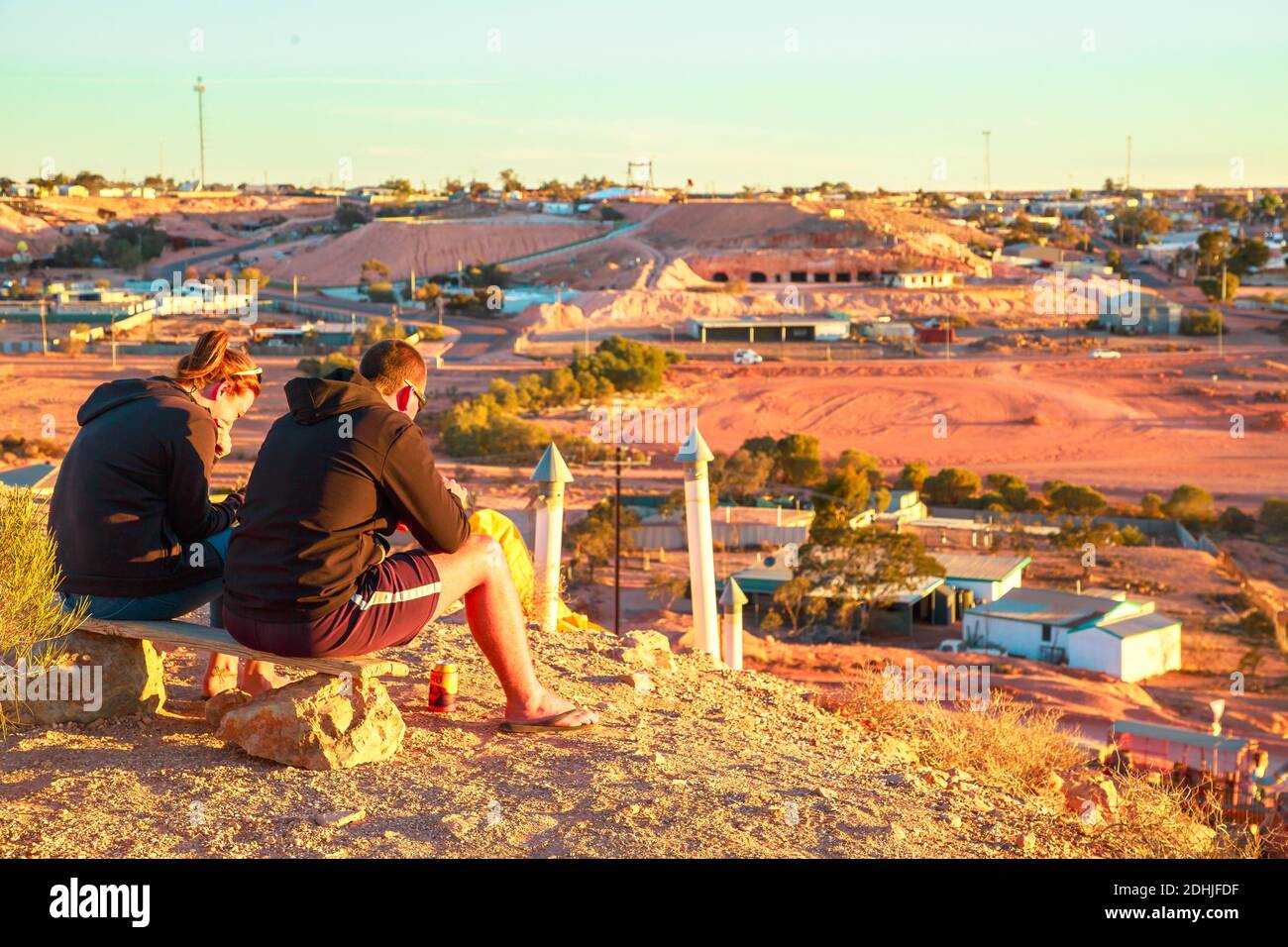 Coober Pedy, South Australia, Australia - Aug 28, 2019: People waiting for sunset in Coober Pedy underground town in Australia from lookout cave in Stock Photo