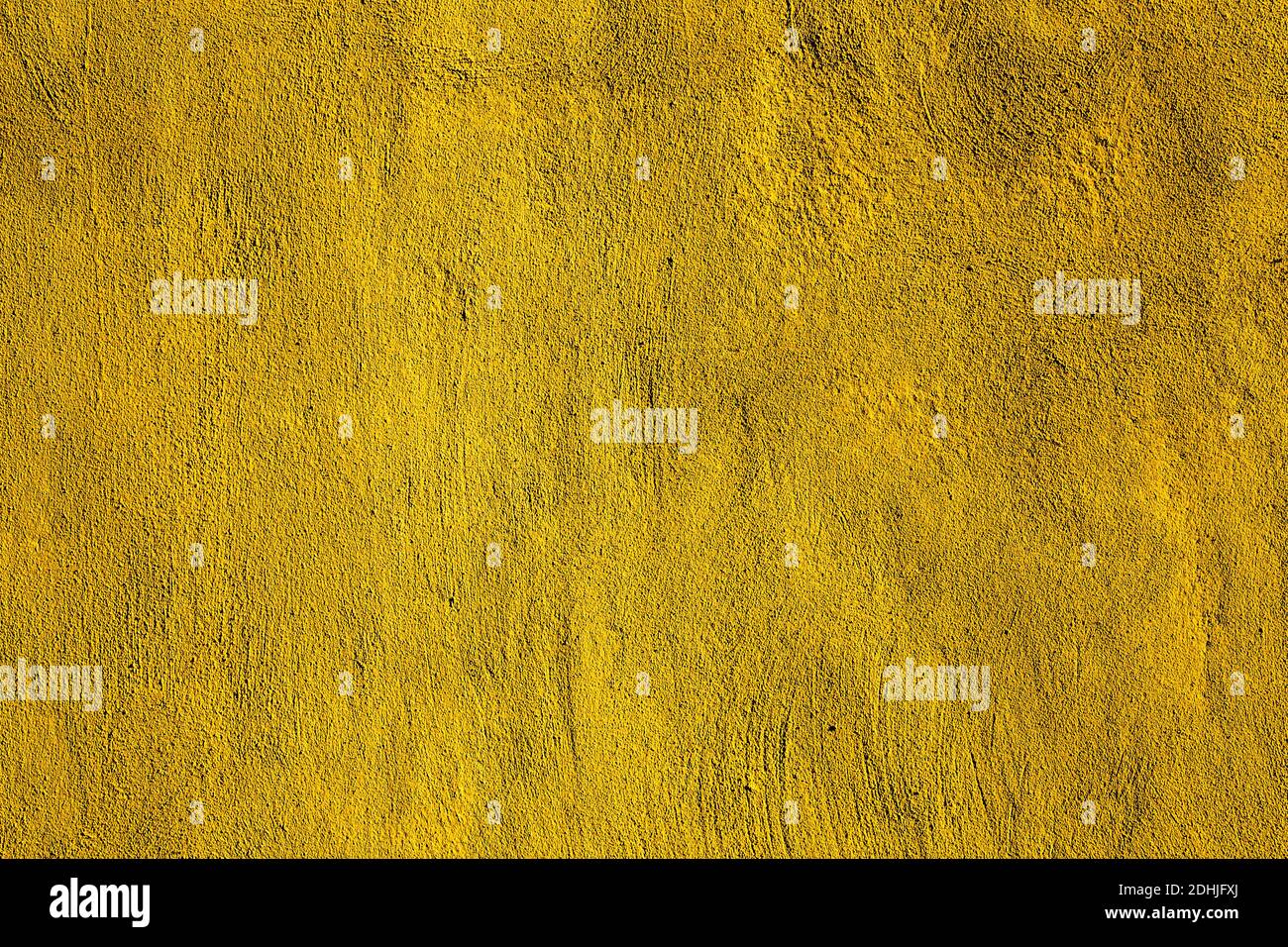 Yellow colored abstract wall background with textures of different shades of gold or yellow Stock Photo
