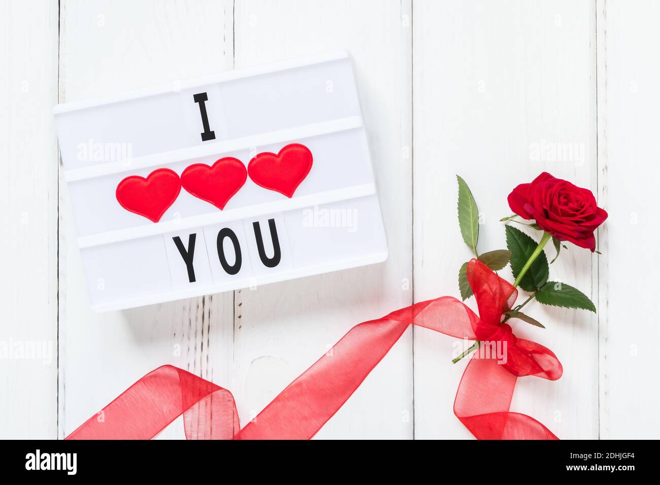 Romantic gift & red roses, isolated on pink background, love concept, Stock image