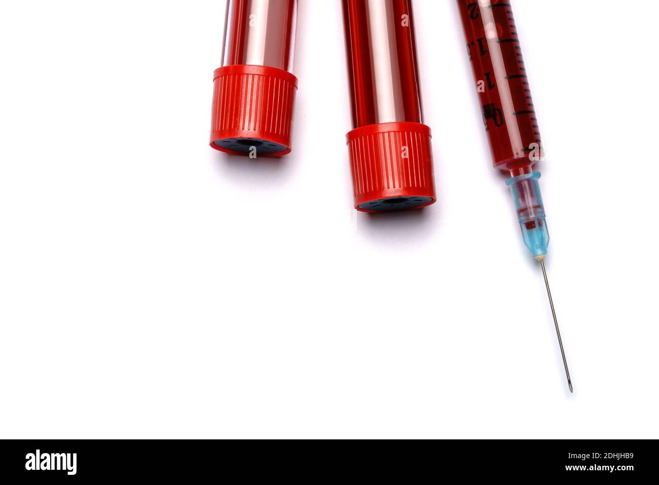 Medical syringe and plastic test tube isolated on white background ...