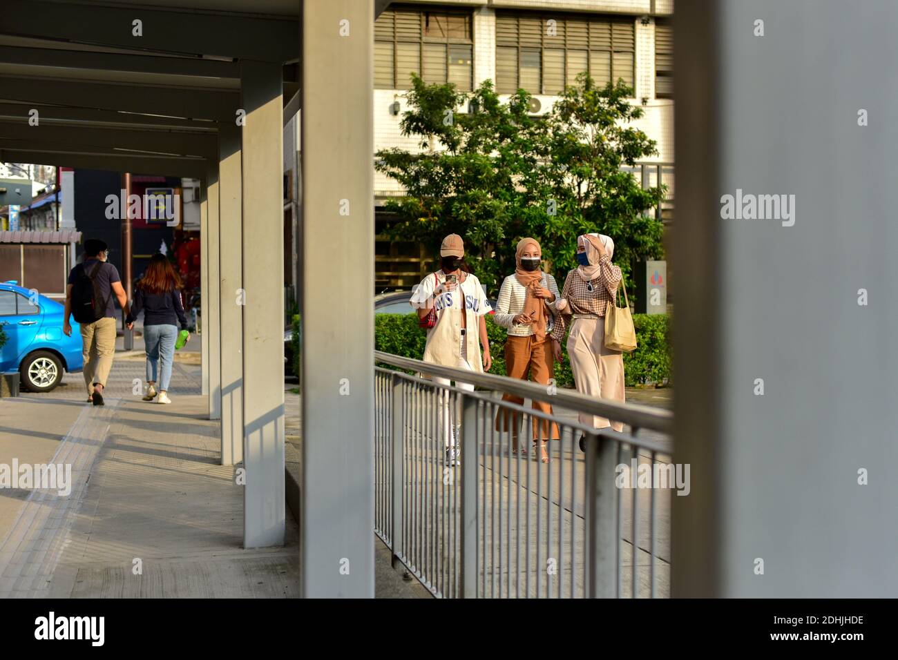 Kuala Lumpur, Malaysia. 11th Dec, 2020. Pedestrians wearing face masks walk on the street in Kuala Lumpur, Malaysia, Dec. 11, 2020. Malaysia reported 1,810 new COVID-19 infections, bringing the national total to 80,309, the health ministry said on Friday. Credit: Chong Voon Chung/Xinhua/Alamy Live News Stock Photo