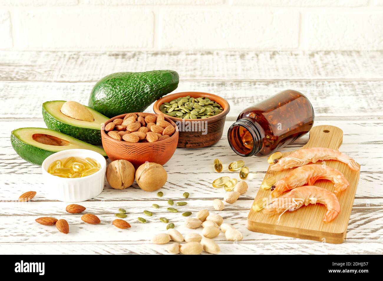 Animal and vegetable sources of omega-3 acids. Balanced diet concept. Assortment of healthy food on woodent table, Stock Photo