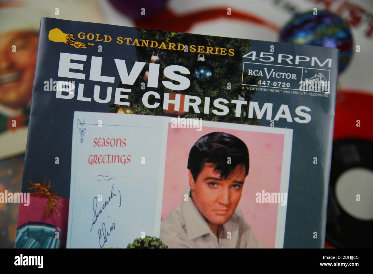 Viersen, Germany - December 9. 2020: Close up of vintage vinyl record cover singles with famous christmas songs (focus on Elvis Presley blue christmas Stock Photo